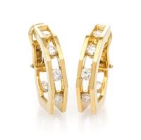 A Pair of 18 Karat Yellow Gold and Diamond Earclips, 11.80 dwts.