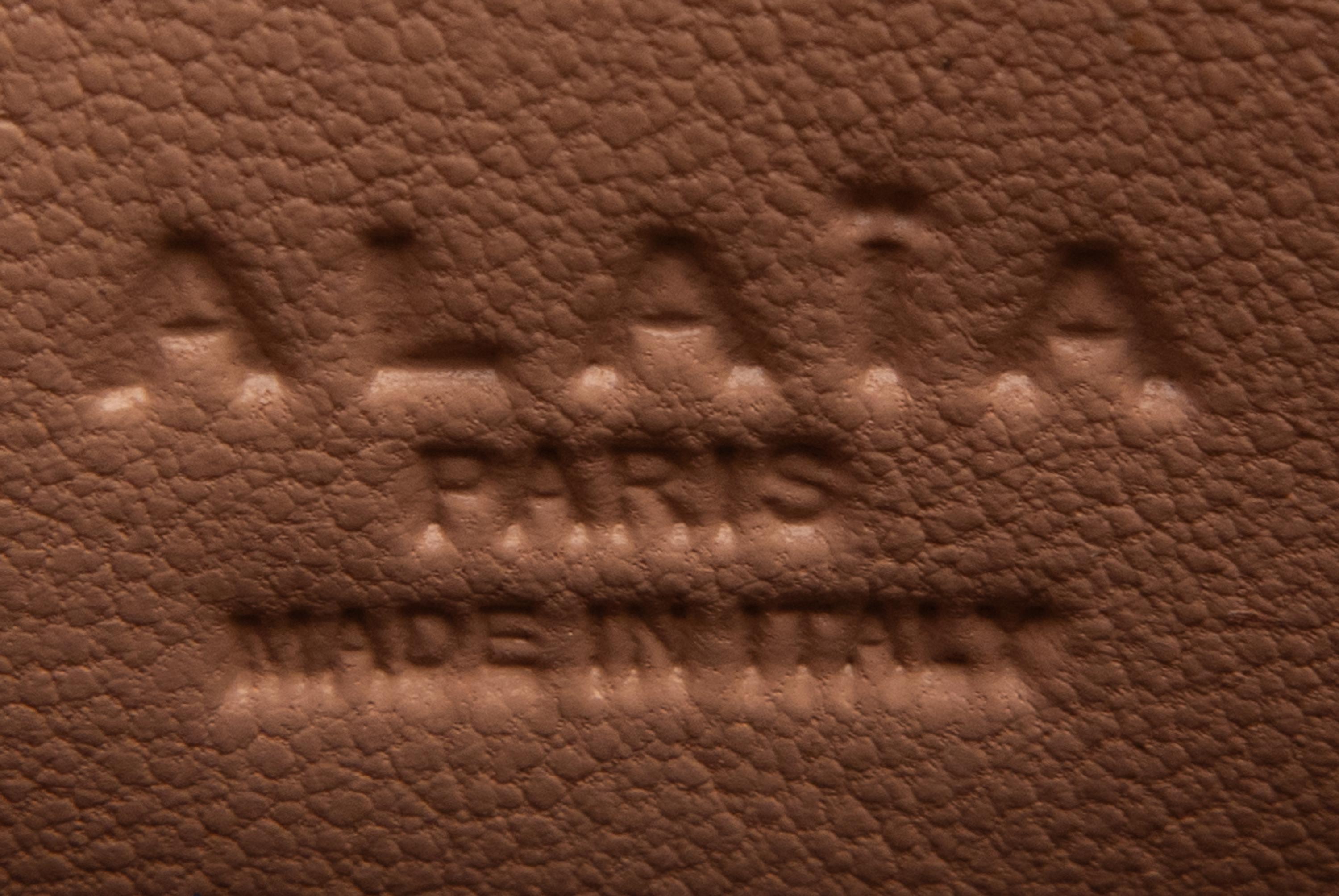 ALAÏA, LASER-CUT LEATHER CLUTCH