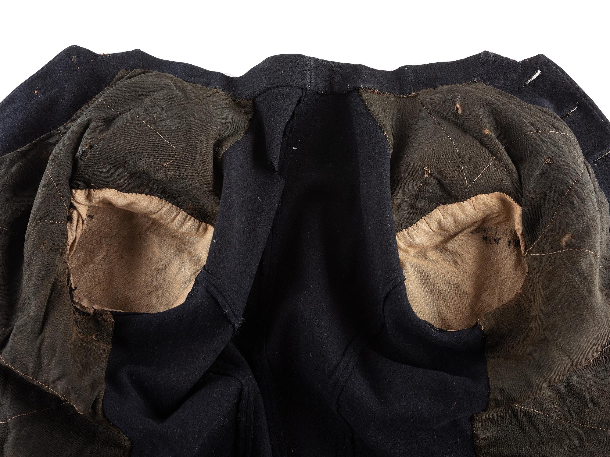 [CIVIL WAR]. A collection of items attributed to Thomas W. Johnson, Co. K, 4th Delaware Infantry, incl. frock coat, cap, belt rig, and cartridge box.