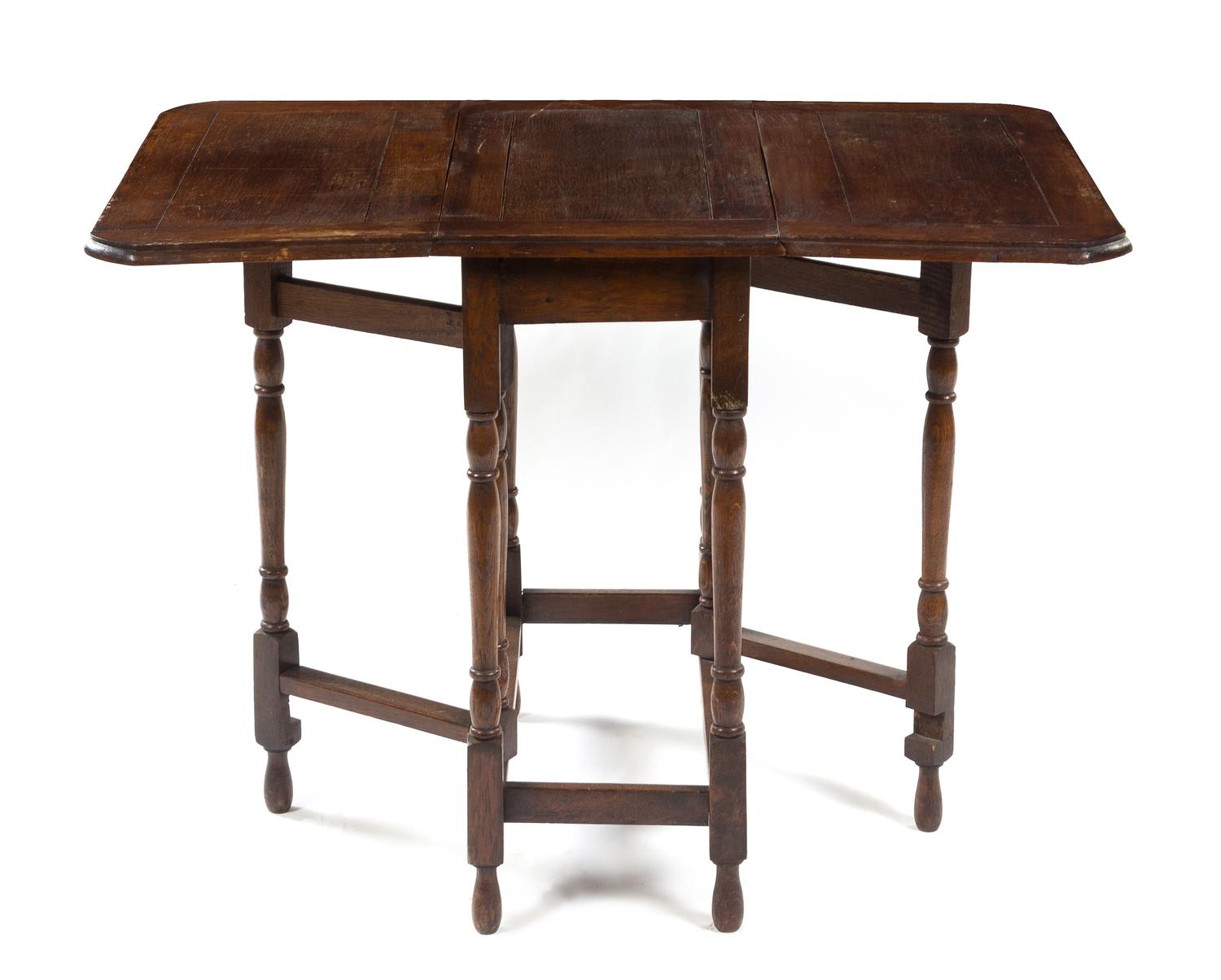 A Provincial Oak Drop-Leaf Table Height 29 x width 25 3/4 x depth 14 inches. — LATE 19TH/EARLY 20TH CENTURY