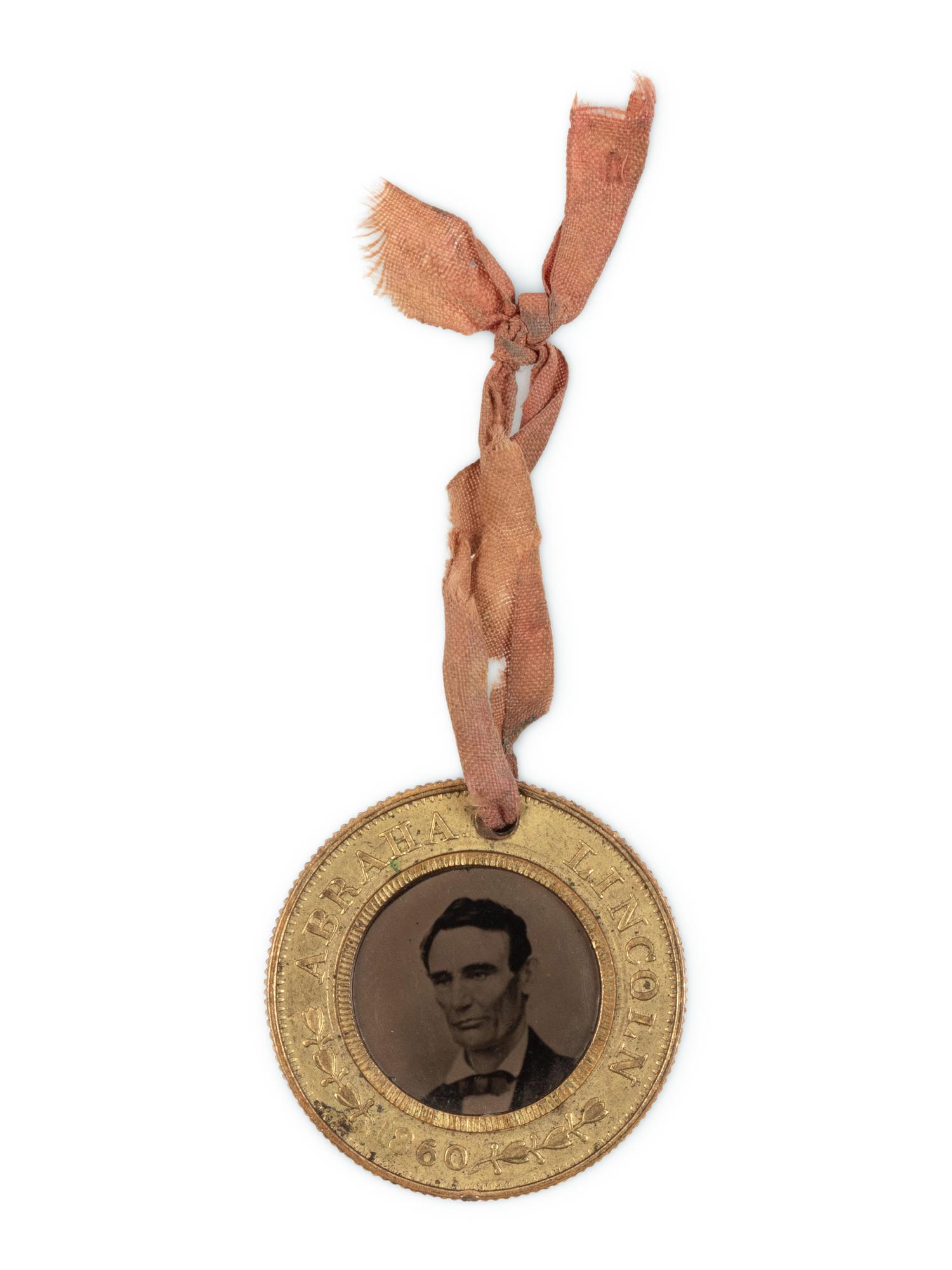 [LINCOLN-HAMLIN CAMPAIGN]. A presidential campaign token featuring ferrotype portraits of Lincoln and Hamlin, ca. 1860.