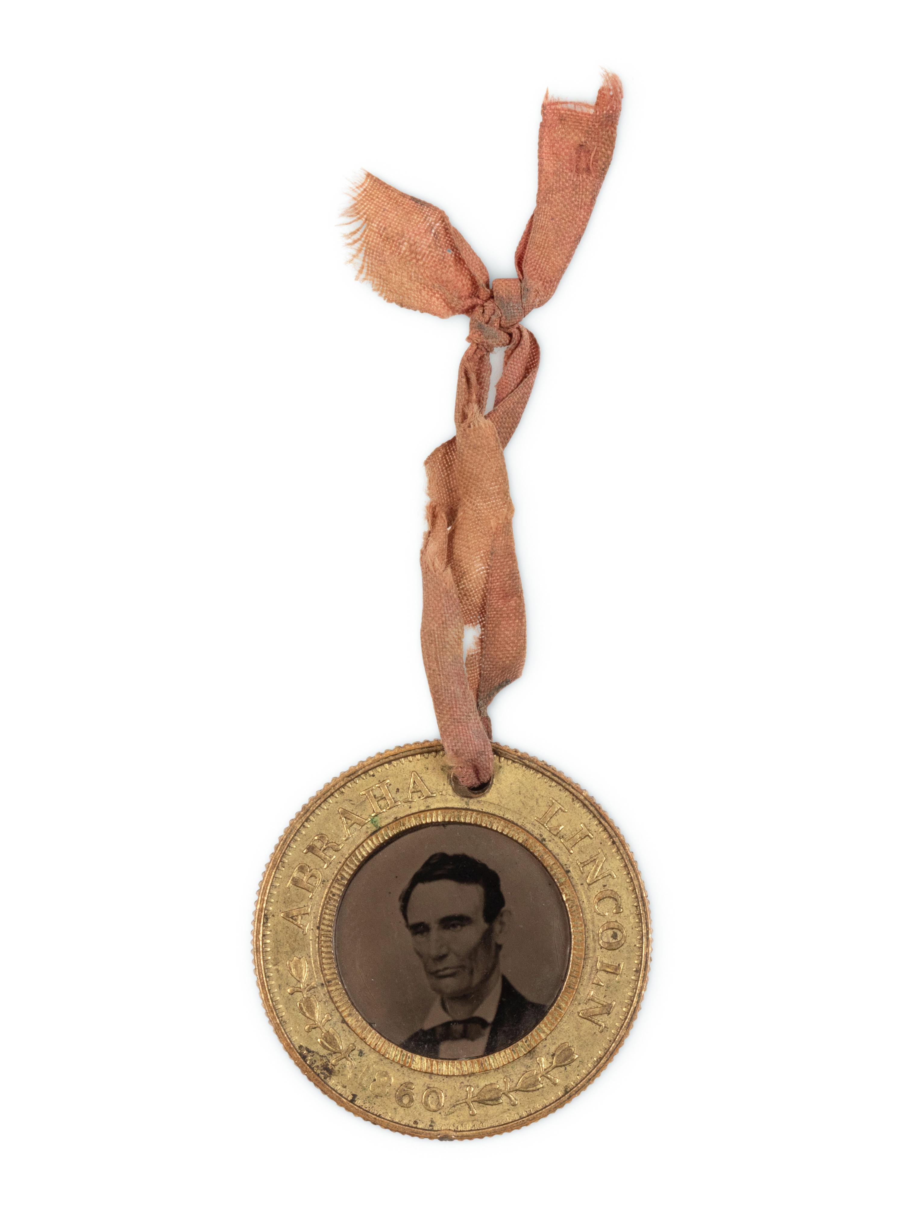 [LINCOLN-HAMLIN CAMPAIGN]. A presidential campaign token featuring ferrotype portraits of Lincoln and Hamlin, ca. 1860.