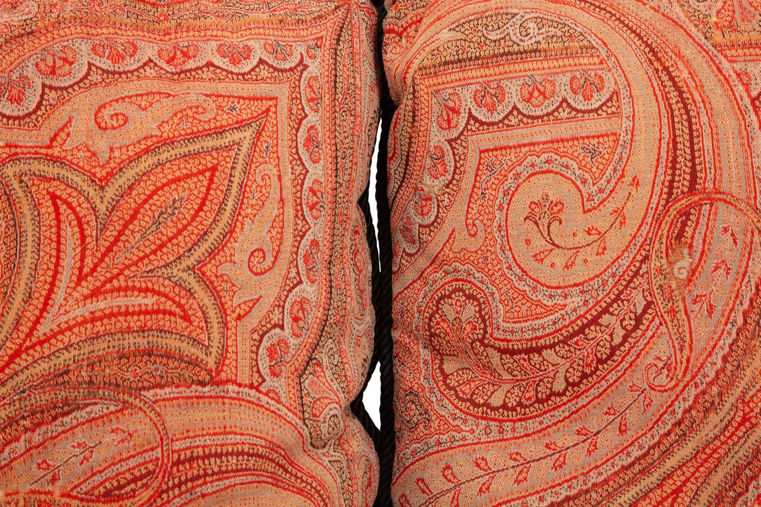 Four Paisley Covered Pillows with Black Braid Trim