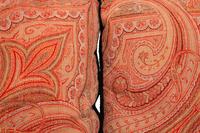 Four Paisley Covered Pillows with Black Braid Trim