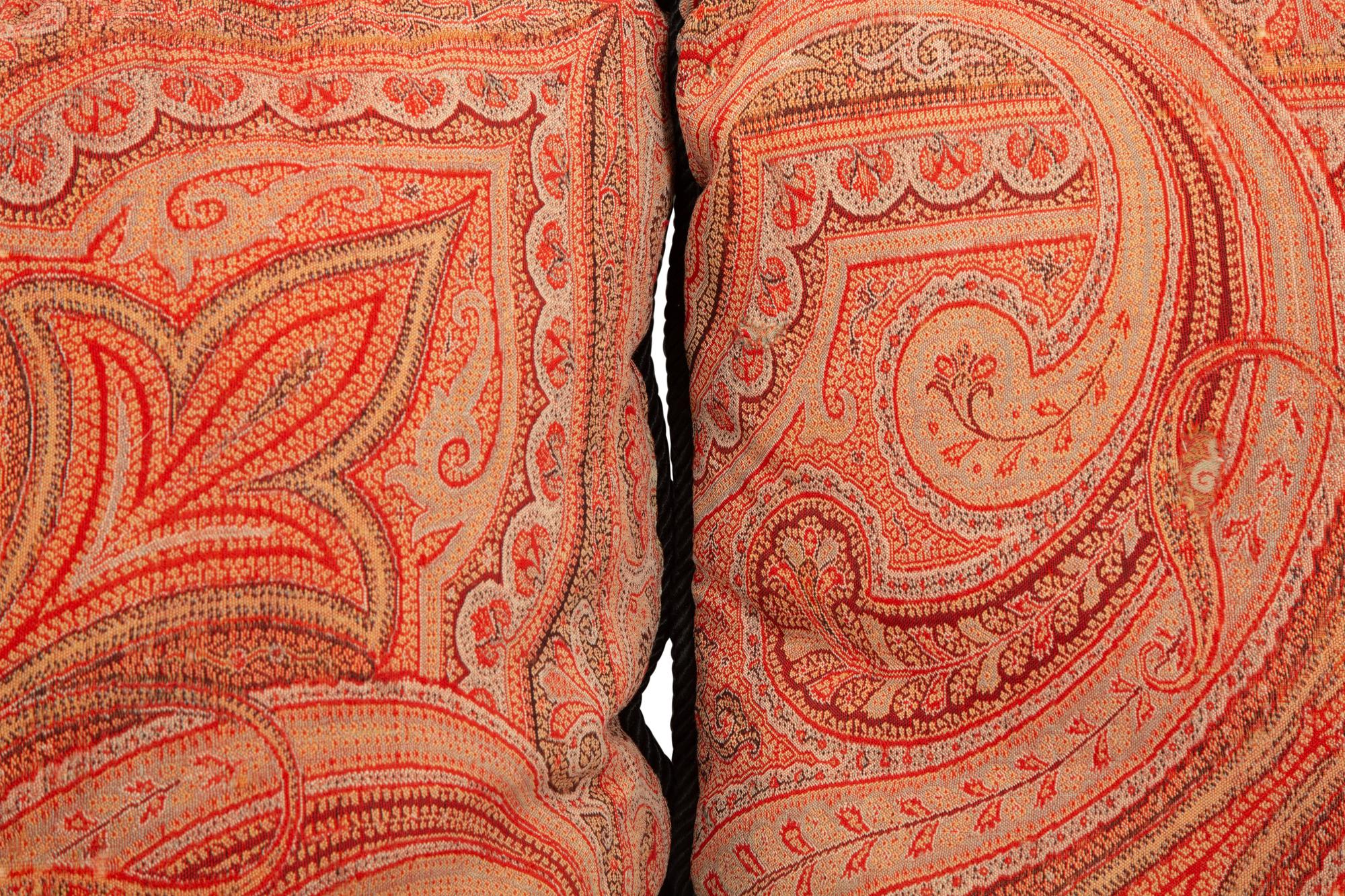 Four Paisley Covered Pillows with Black Braid Trim