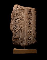 An Egyptian Brown Quartzite Stele Fragment for Lady Ba-Ey-Maaty