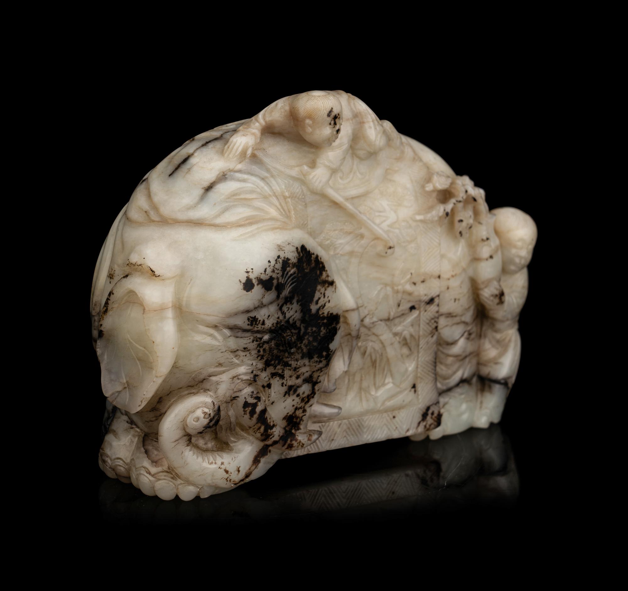 A Carved Jade ‘Elephant and Children’ Figural Group