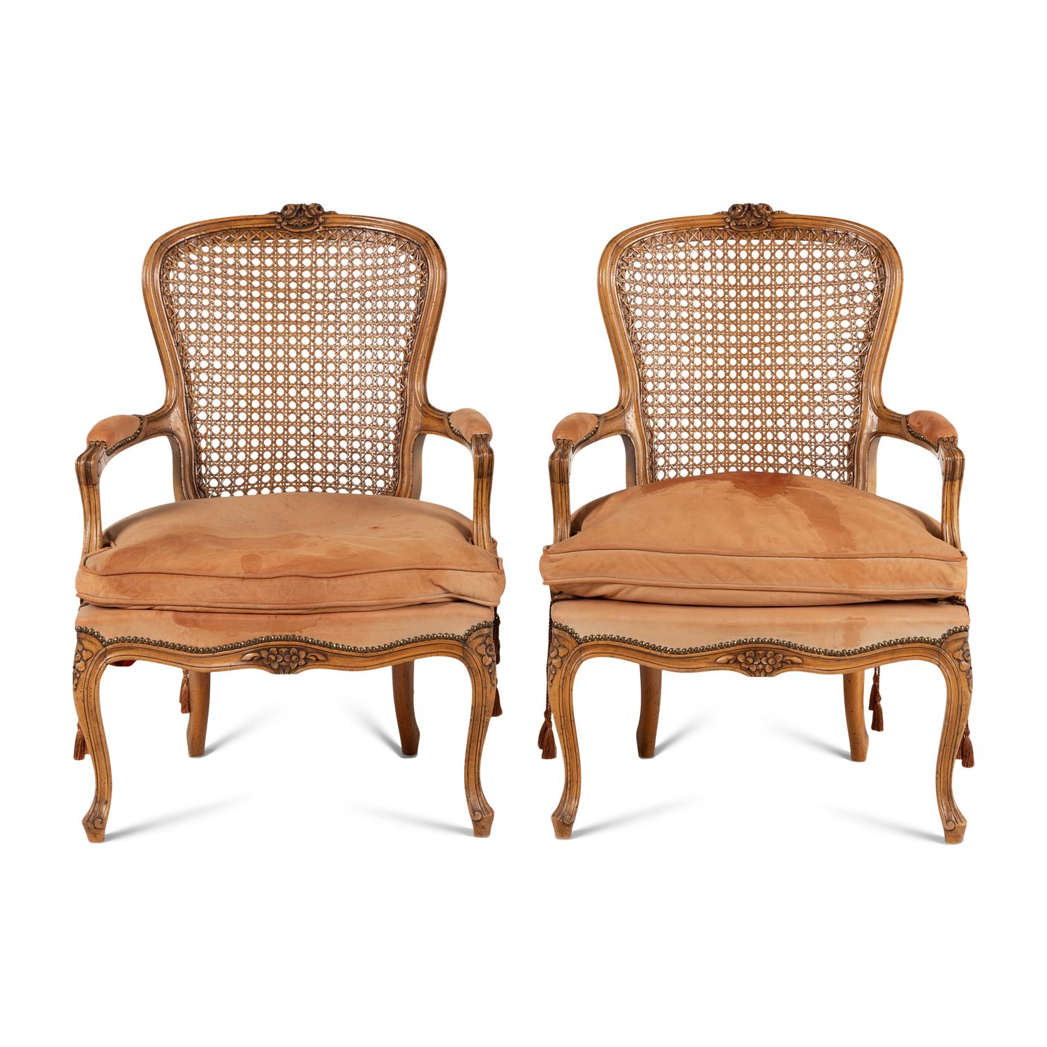 A Pair of Louis XV Style Nubuck Upholstered and Caned Fauteuils