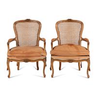 A Pair of Louis XV Style Nubuck Upholstered and Caned Fauteuils