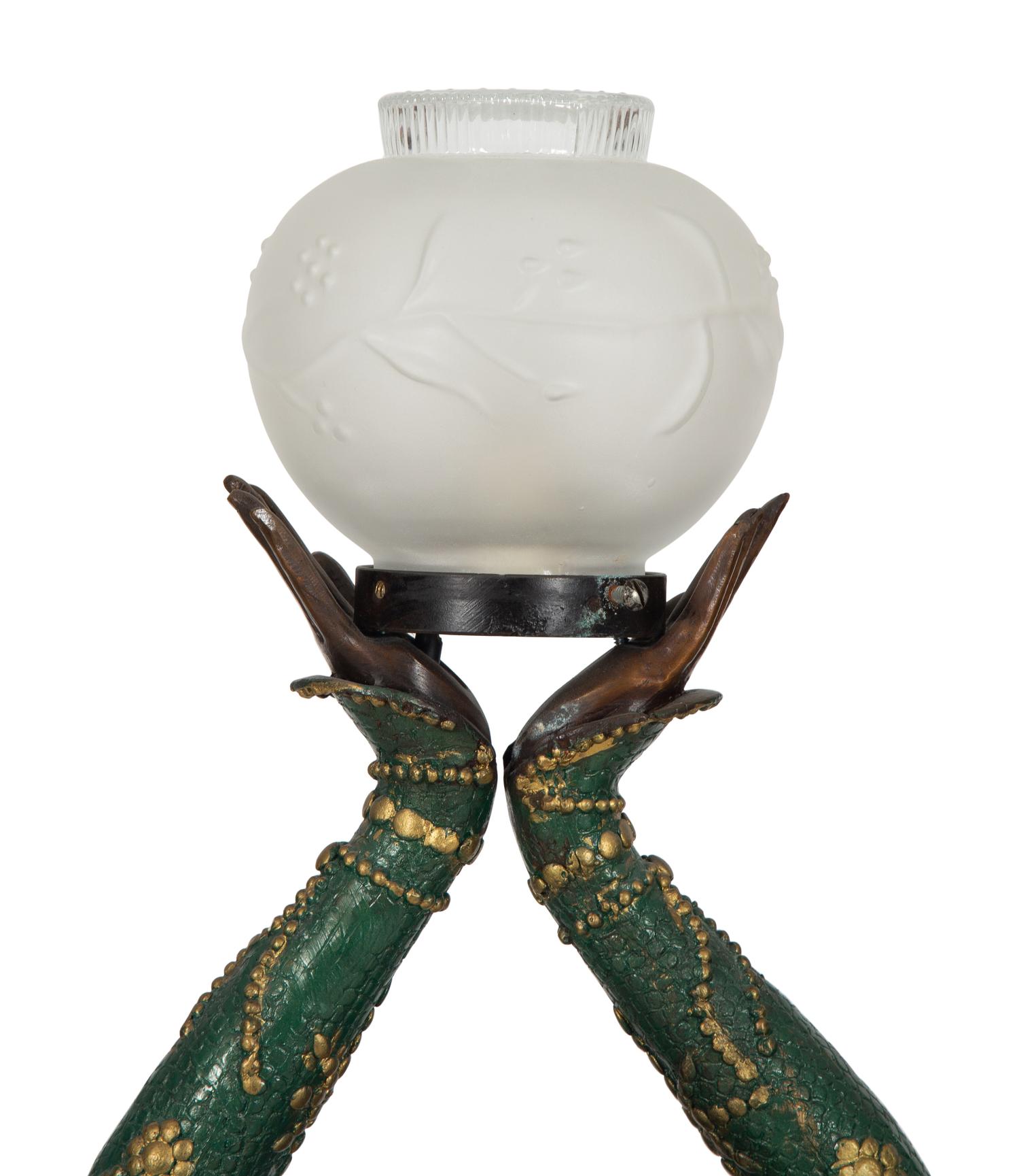 A Polychromed Metal Figural Floor Lamp in the Style of Chiparus