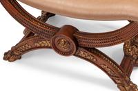 A Pair of Continental Parcel Gilt Walnut Curule Stools