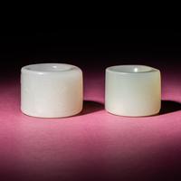 Two Chinese Jade Archer's Rings, 18th/19th Century — 清中期 白玉留皮扳指兩枚