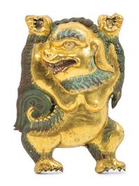 A Sino-Tibetan Gilt Bronze Repoussé Fu-Lion