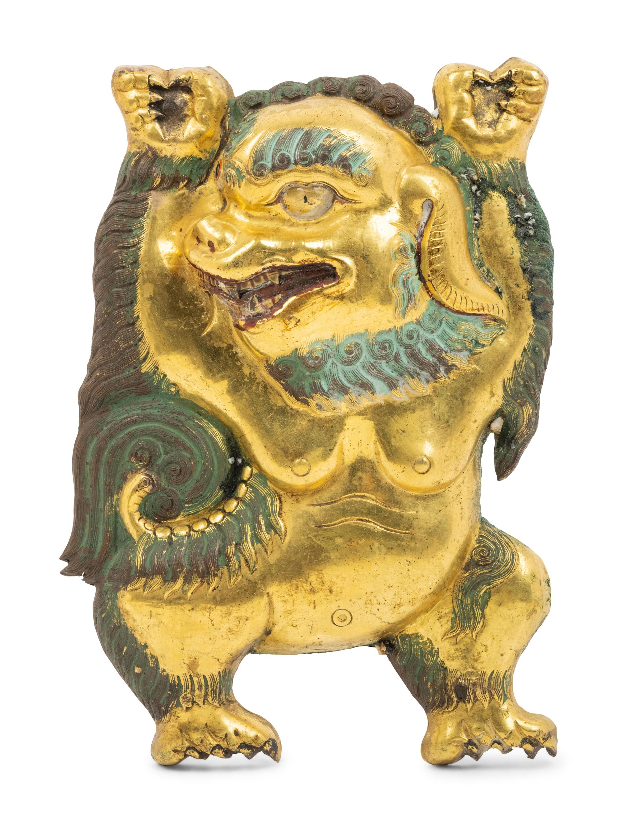 A Sino-Tibetan Gilt Bronze Repoussé Fu-Lion