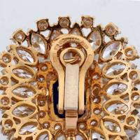 A pair of sapphire, diamond, and eighteen karat gold ear clips