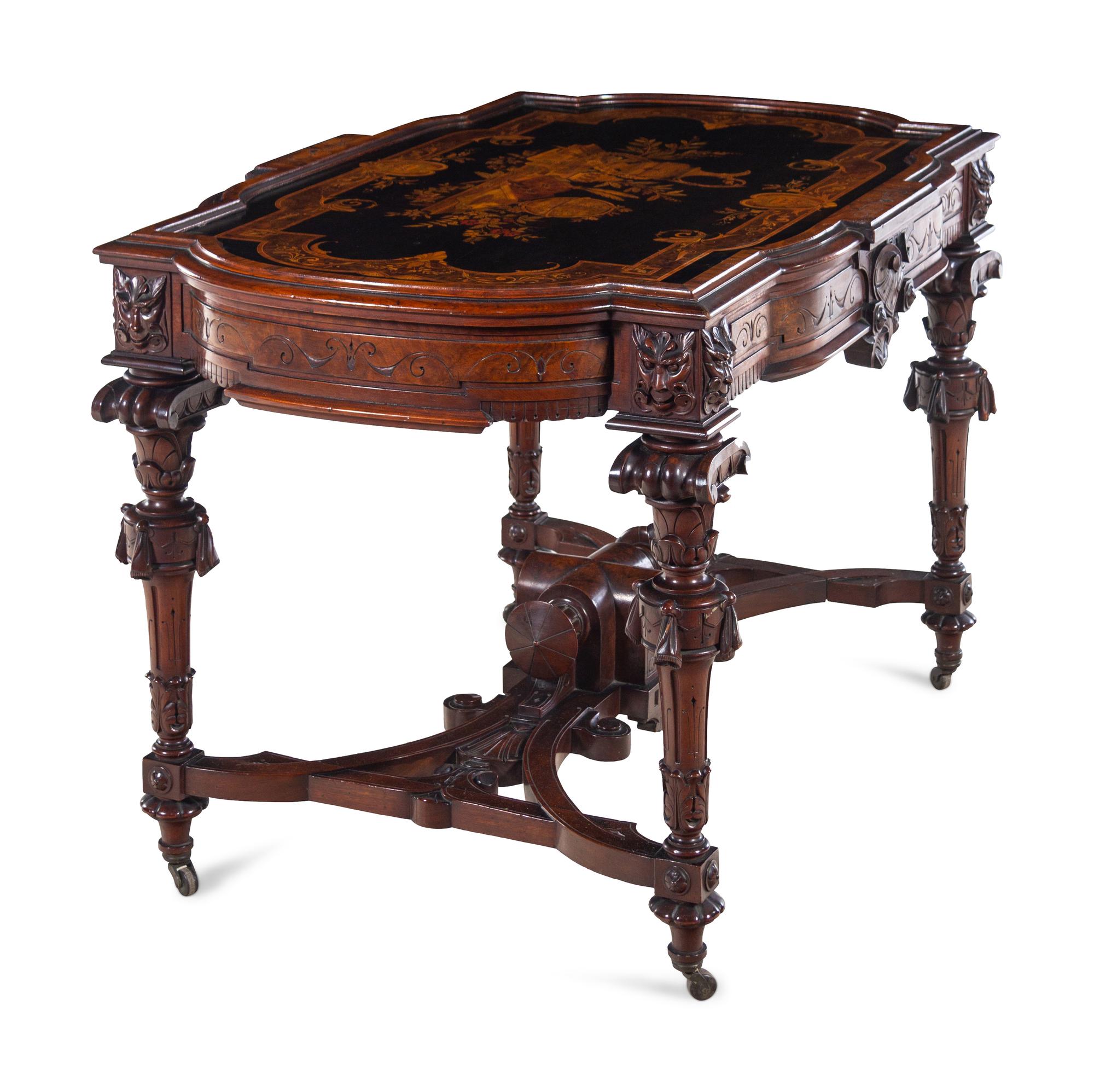 A Victorian Carved, Inlaid and Painted Walnut Writing Desk