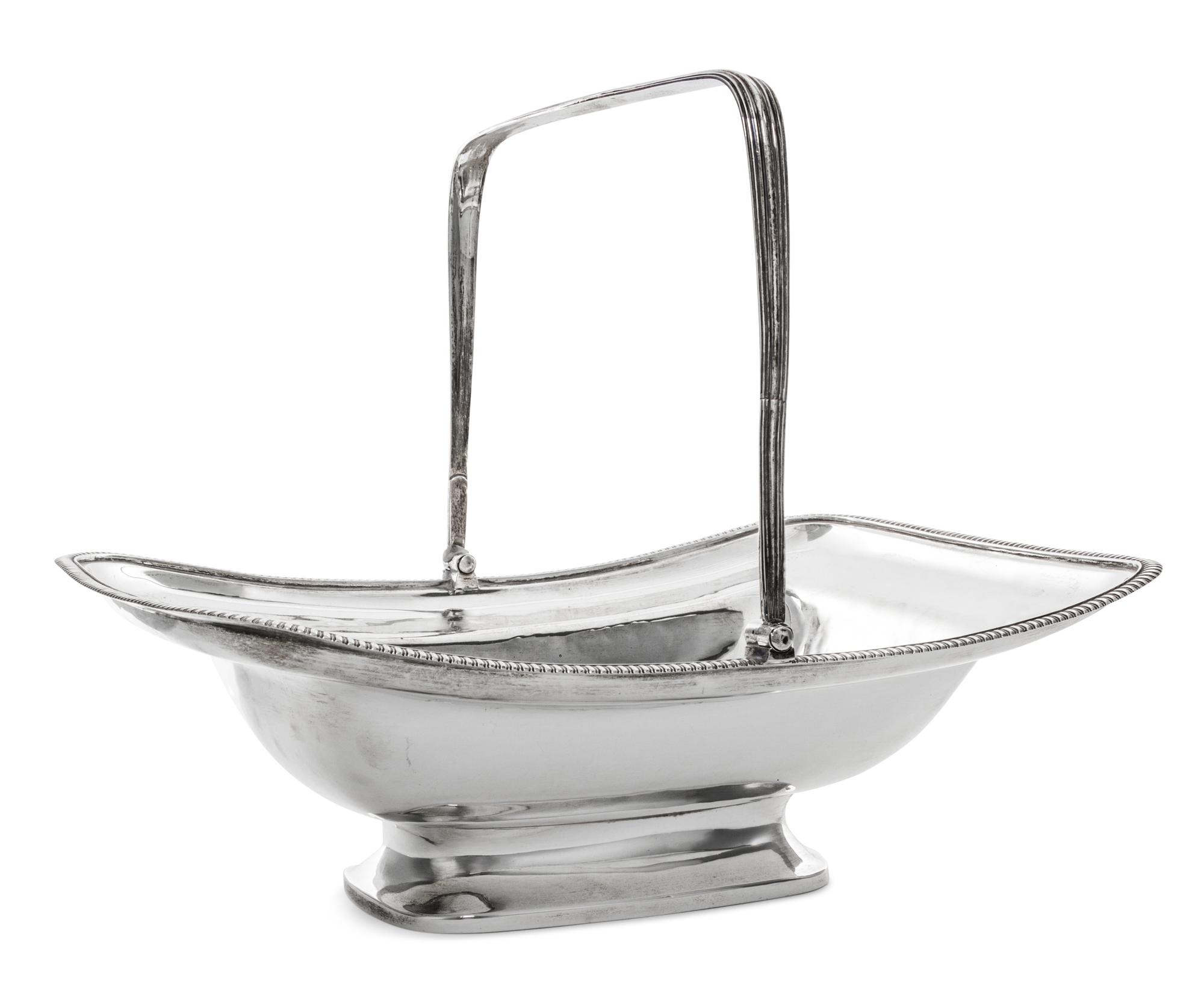 A George III Silver Basket, Solomon Hougham, London, 1805, with a swing handle and a gadrooned border.
