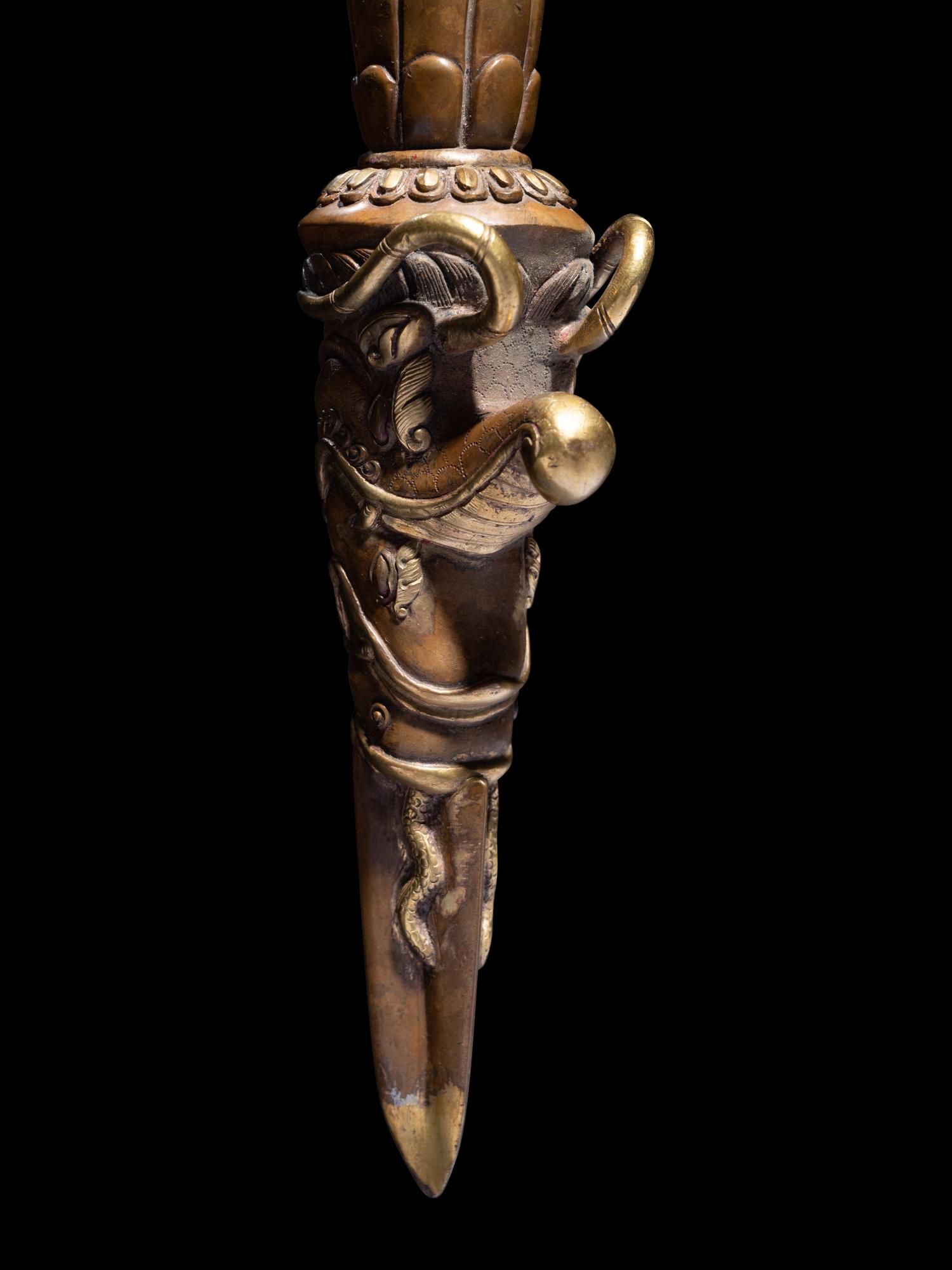 Two Tibetan Gilt Bronze Ritual Daggers