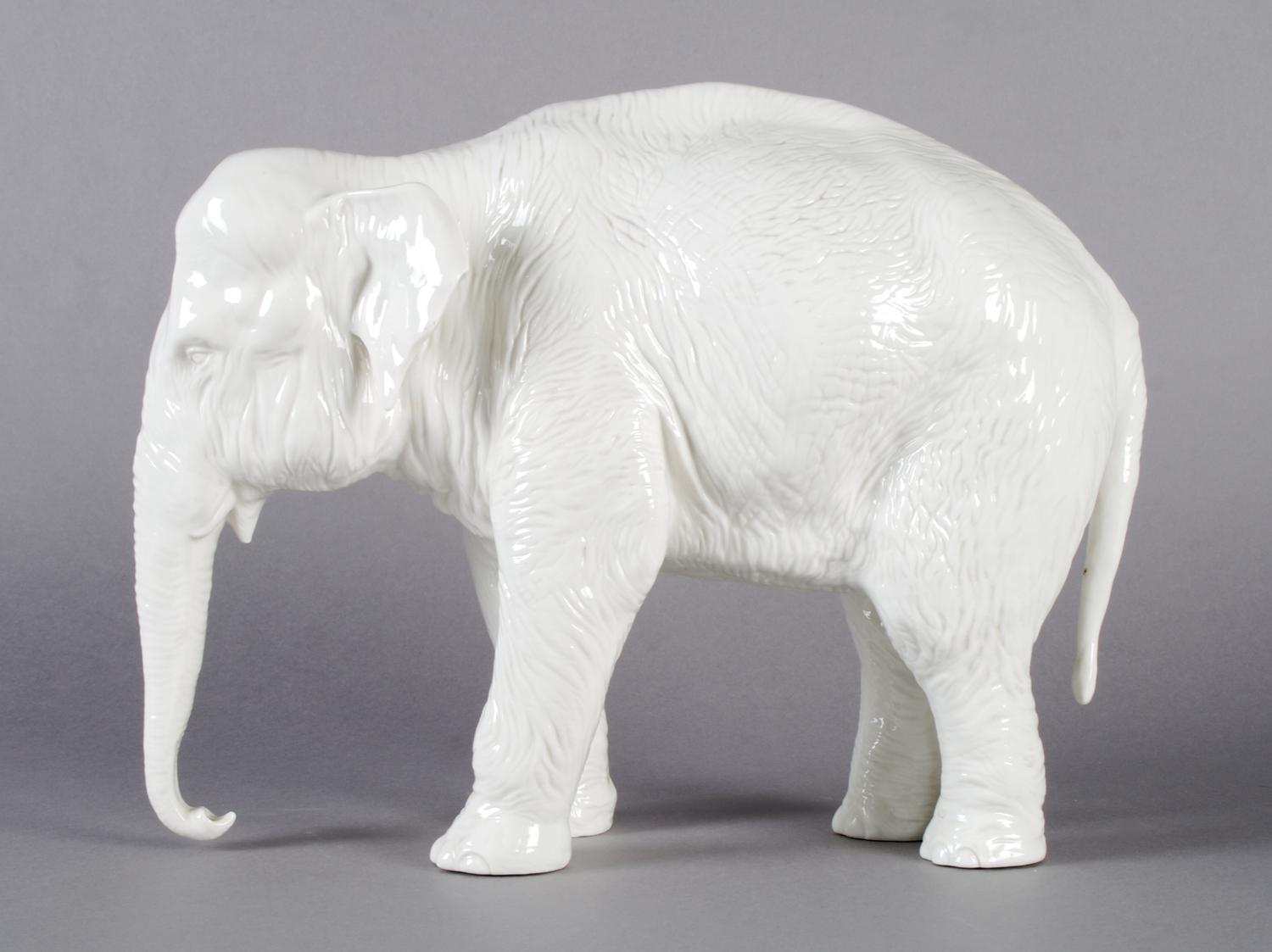 A Nymphenburg Porcelain Figure of an Elephant, Width 12 1/2 inches.