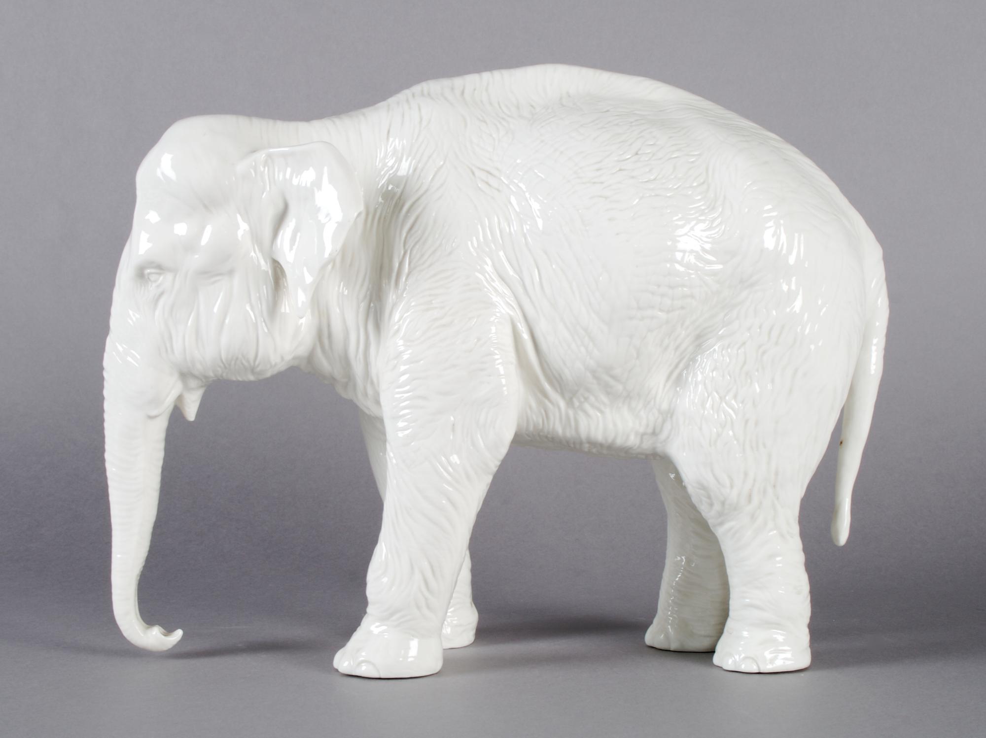 A Nymphenburg Porcelain Figure of an Elephant, Width 12 1/2 inches.
