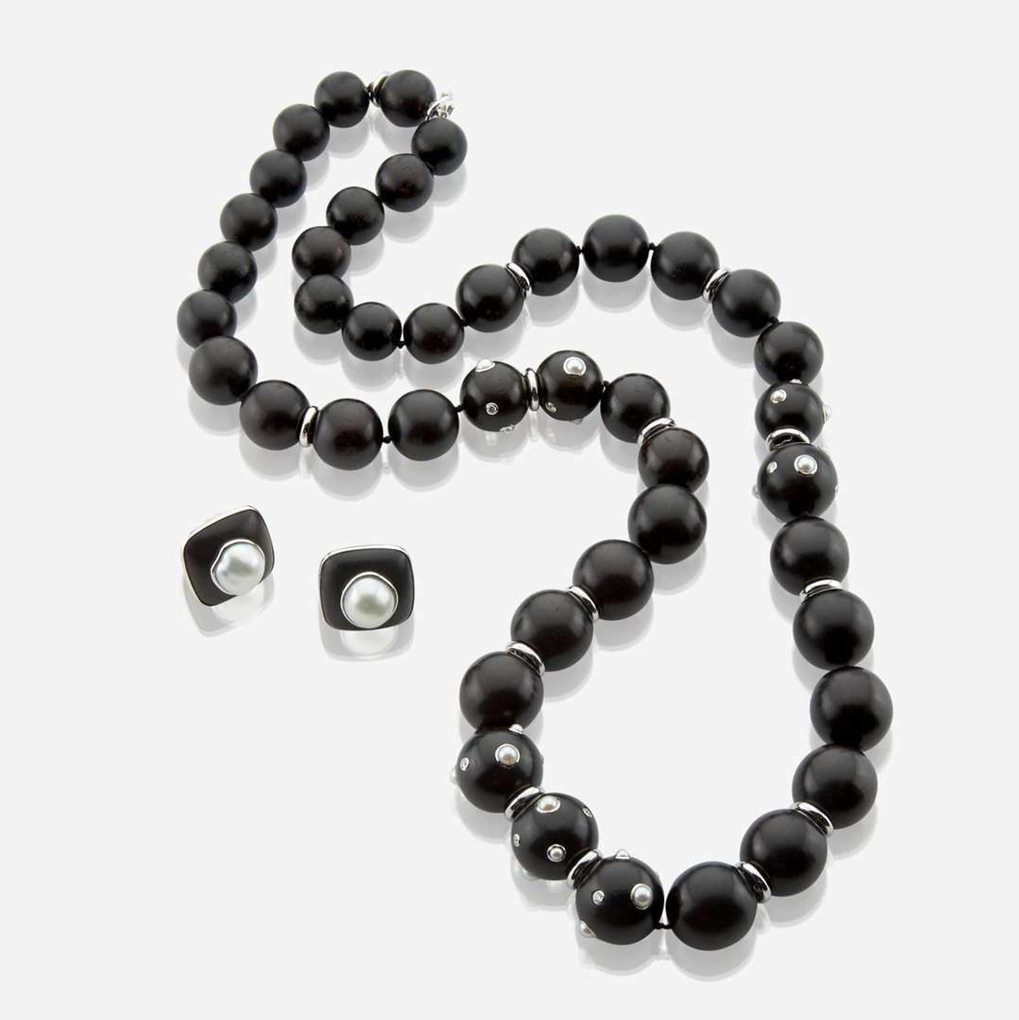 A white gold, ebony, diamond, and pearl necklace with matching earrings Trianon by Seaman Schepps