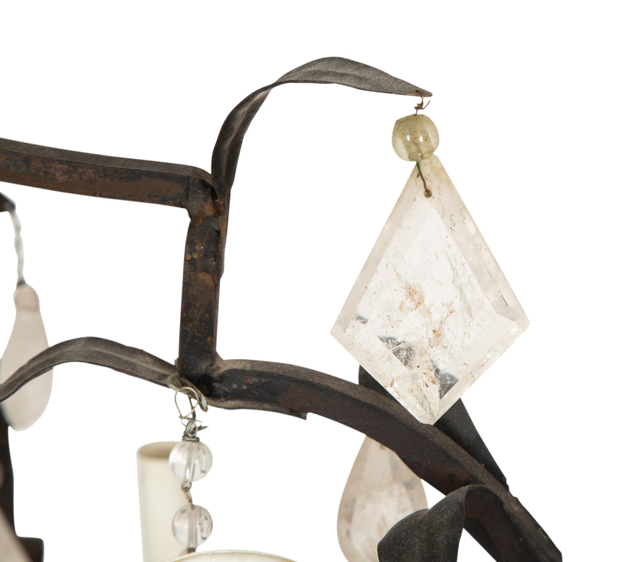 A Wrought Iron and Rock Crystal Eight-Light Chandelier