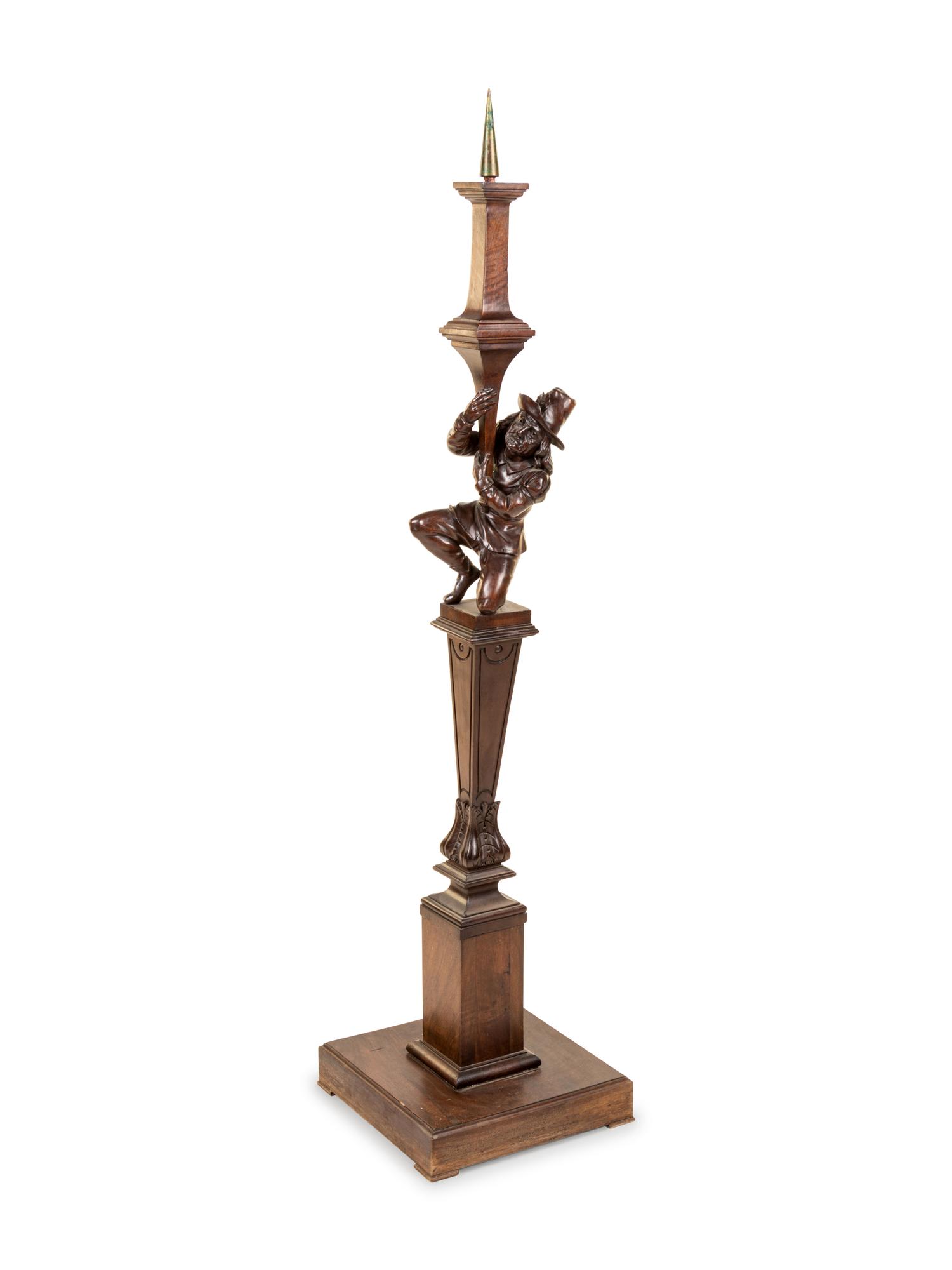 A Black Forest Carved Pricket