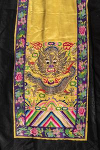 A Chinese Lady's Embroidered Silk Jacket and A Yellow Ground Silk Apron Skirt