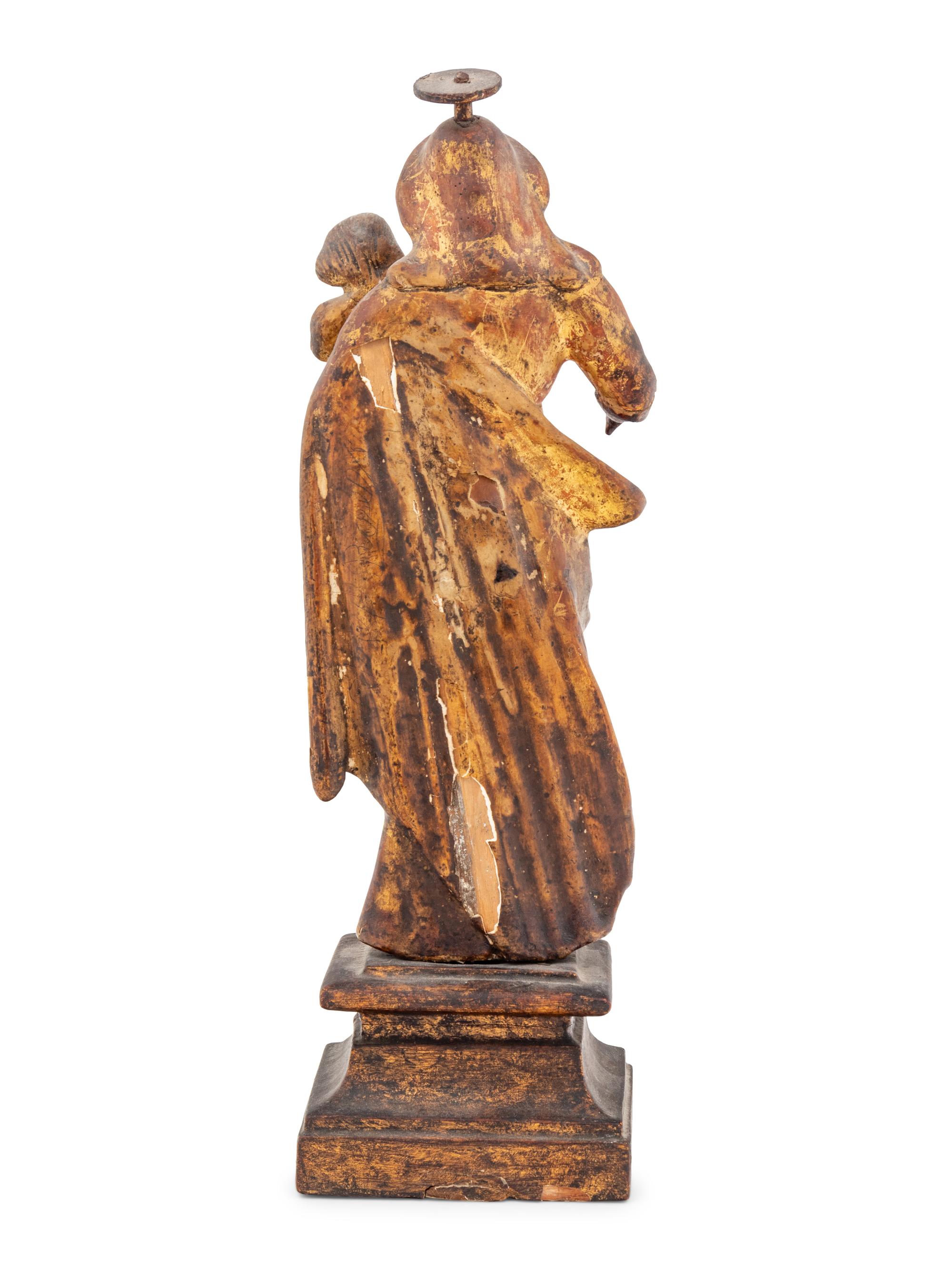 A Continental Carved and Gilt Decorated Santo Figure