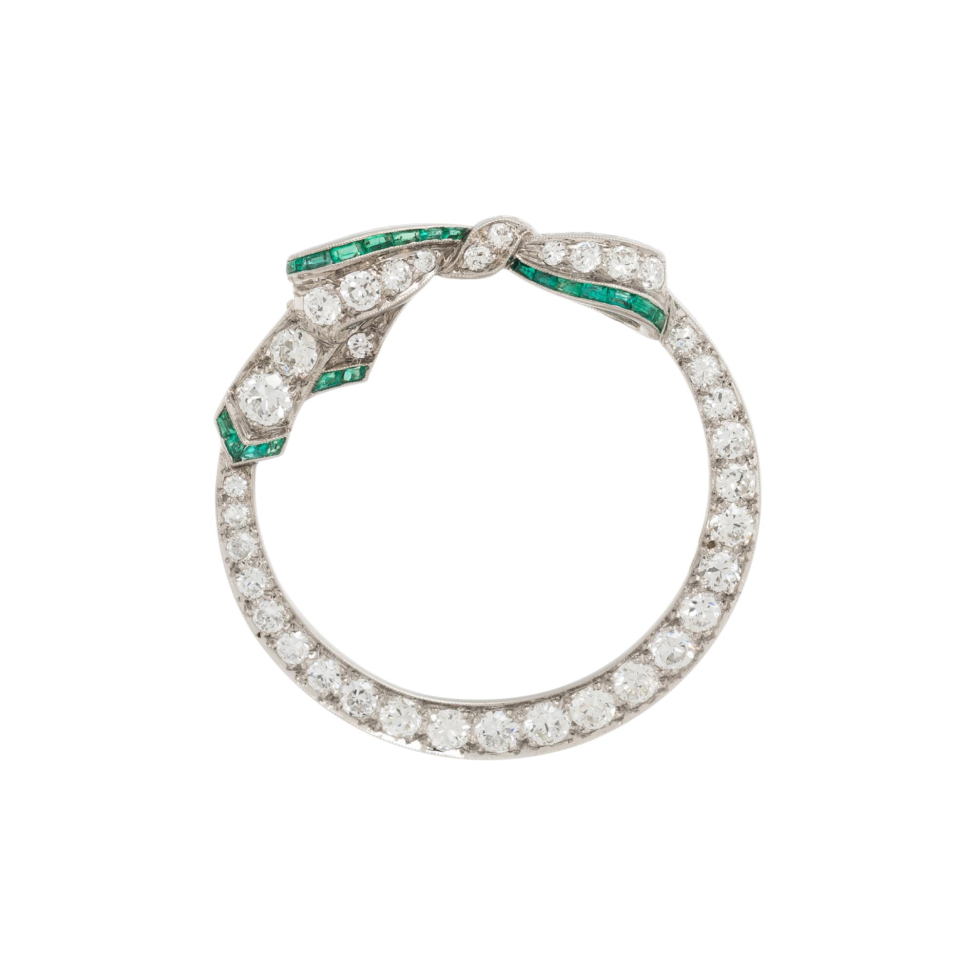 PLATINUM, DIAMOND, AND EMERALD BROOCH