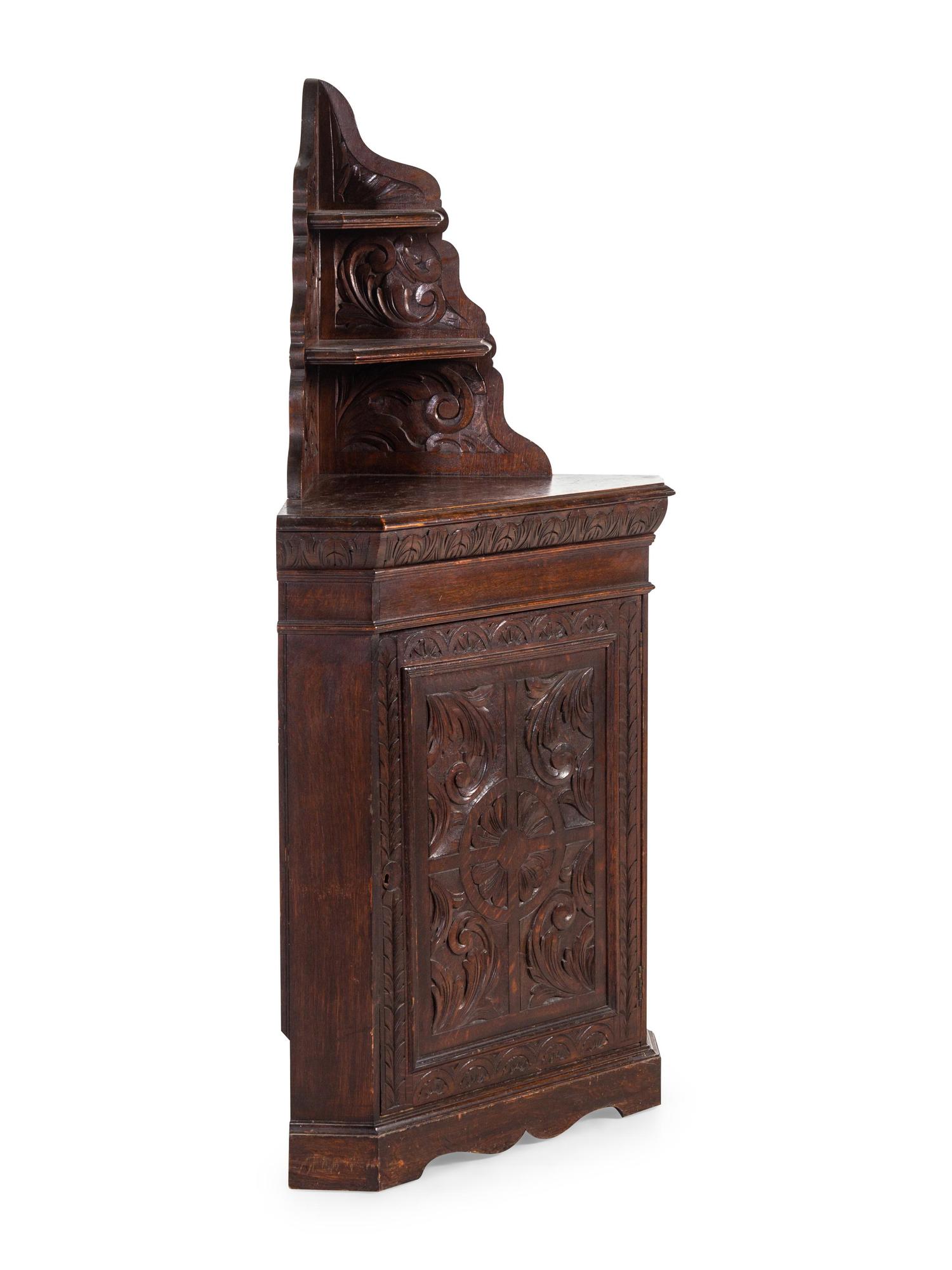 A Renaissance Revival Carved Oak Corner Cabinet