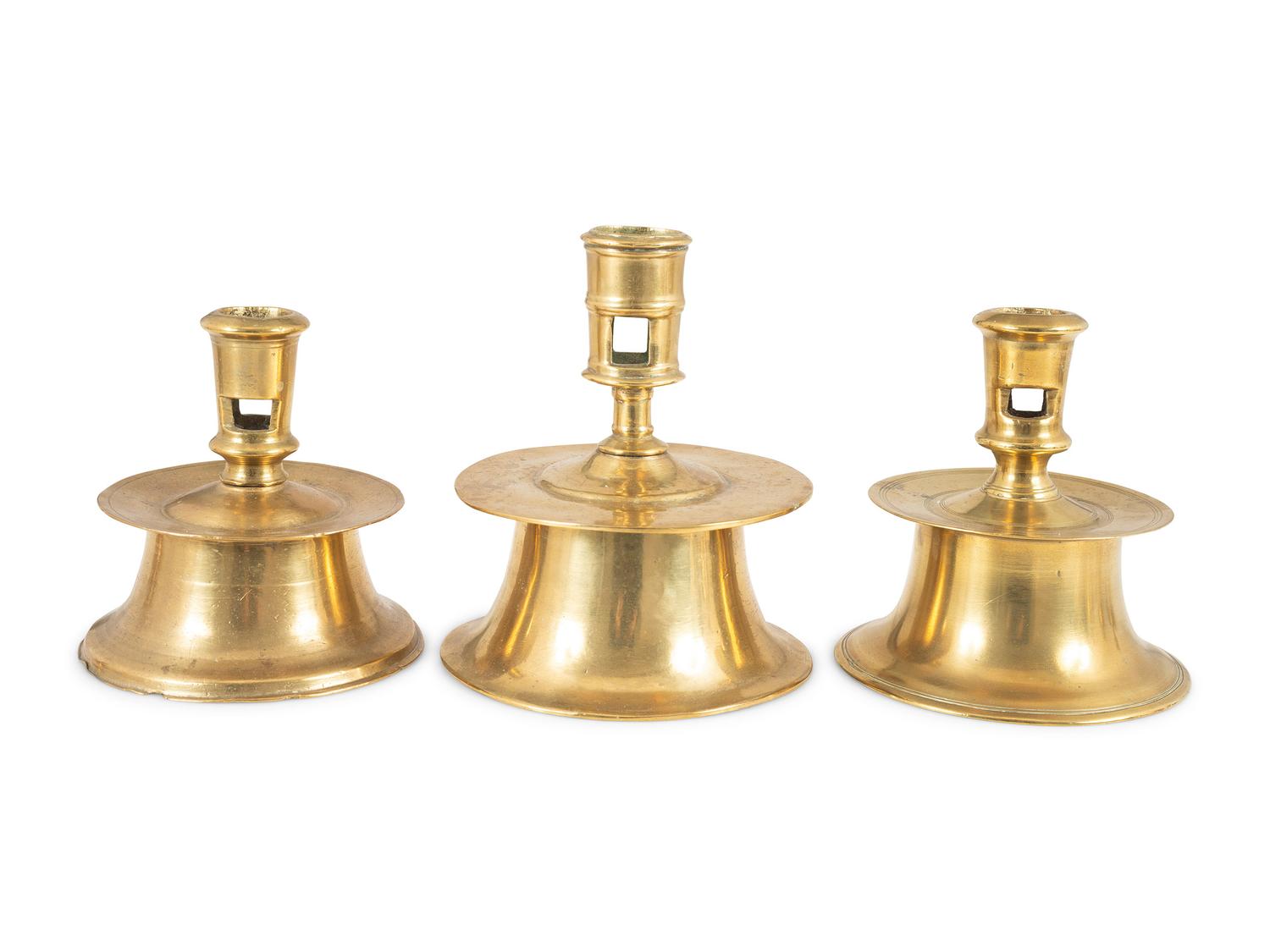 Three Continental Brass Capstan Candlesticks
