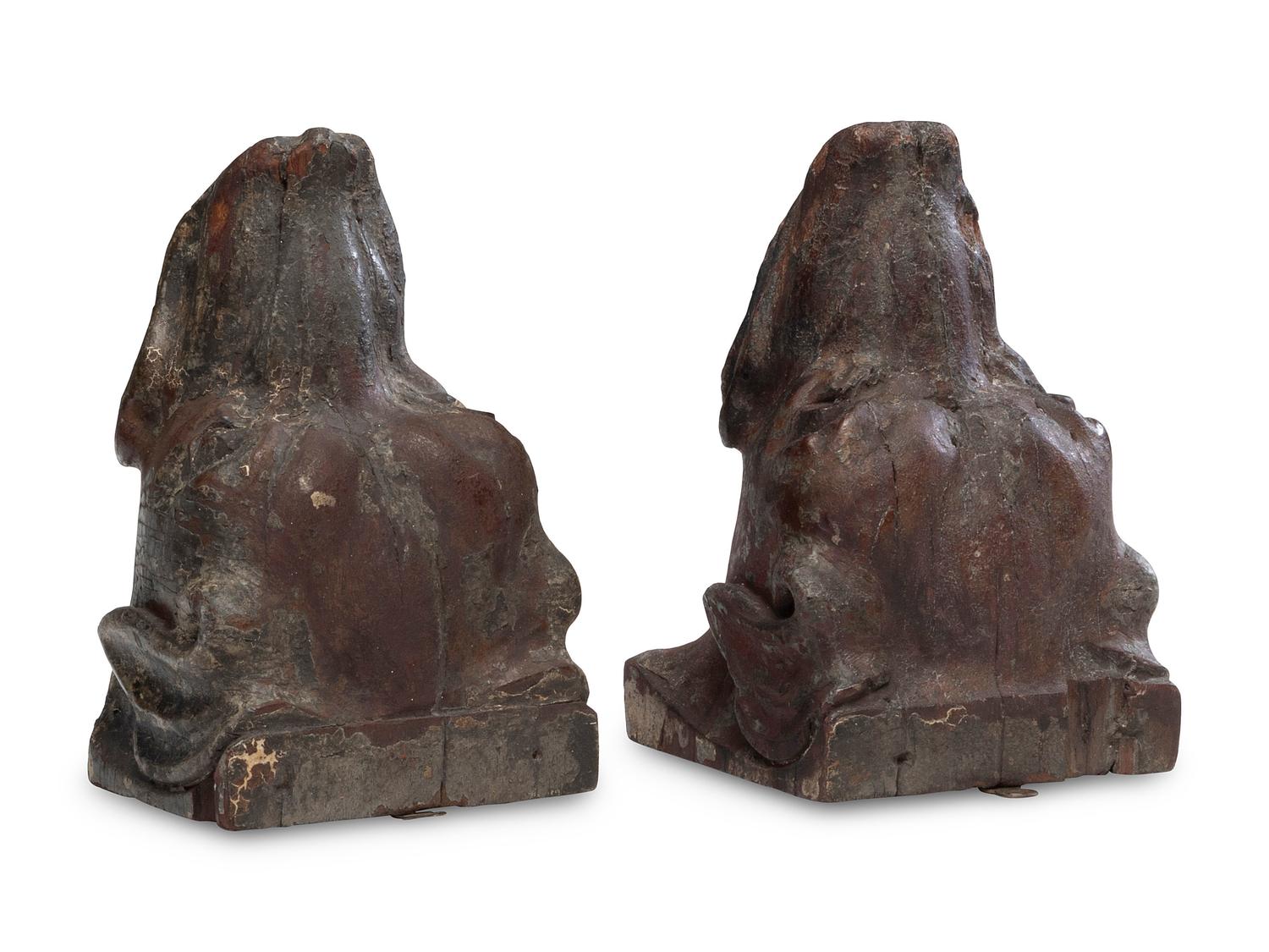 A Pair of Carved Walnut Dog-Form Wall Mounts