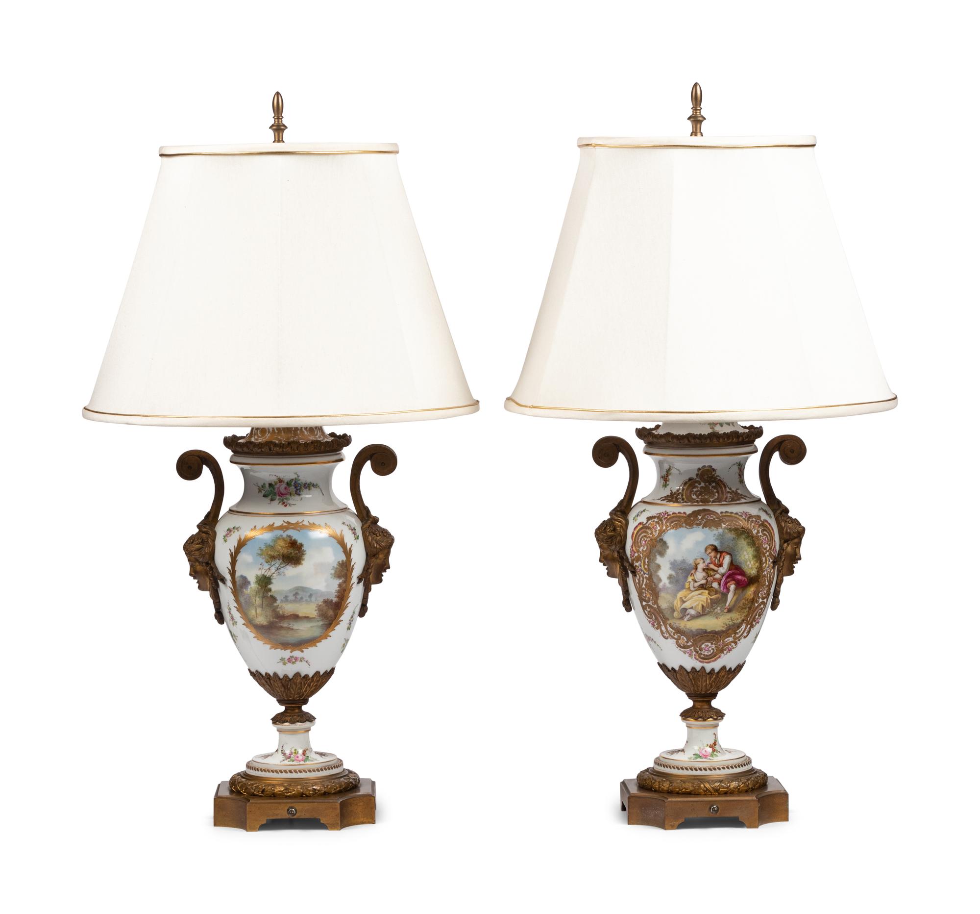 A Pair of Gilt Bronze Mounted Sèvres Style Porcelain Urns Mounted as Lamps