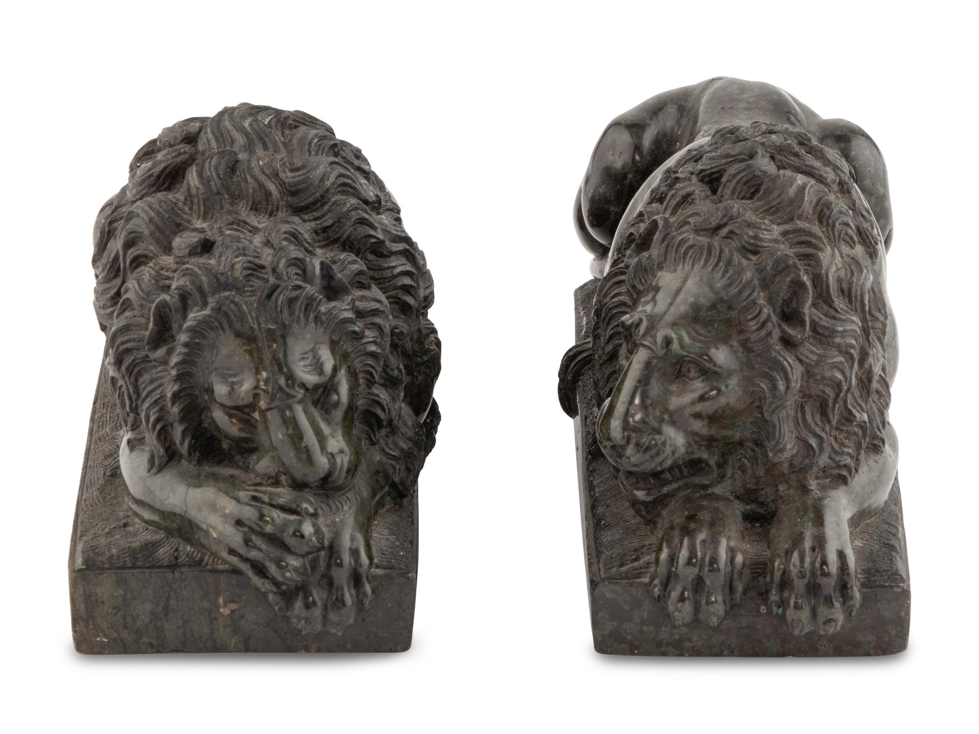 A Pair of Carved Green Marble Recumbent Lions