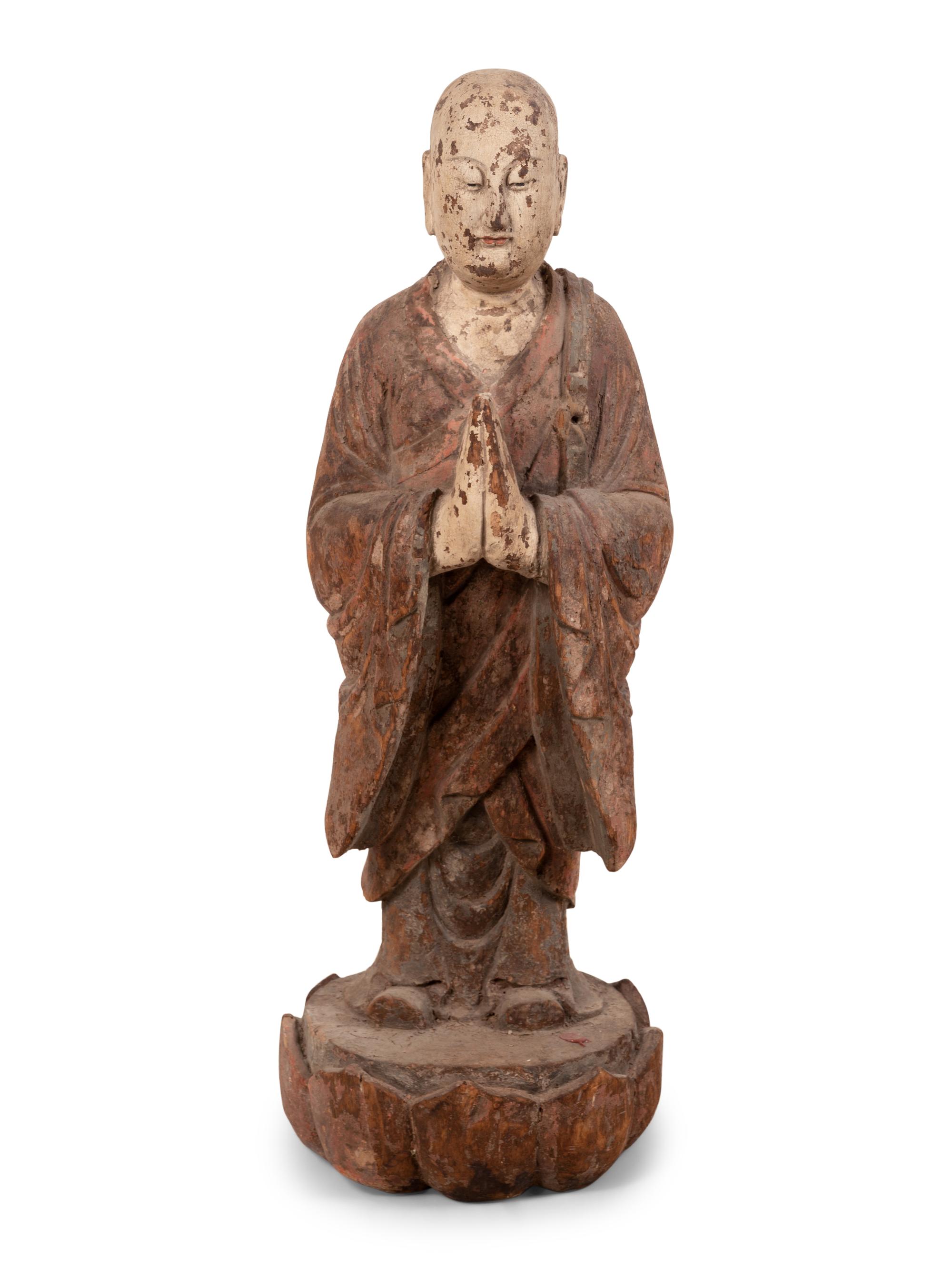 A Chinese Carved and Polychrome Decorated Wood Figure in Prayer