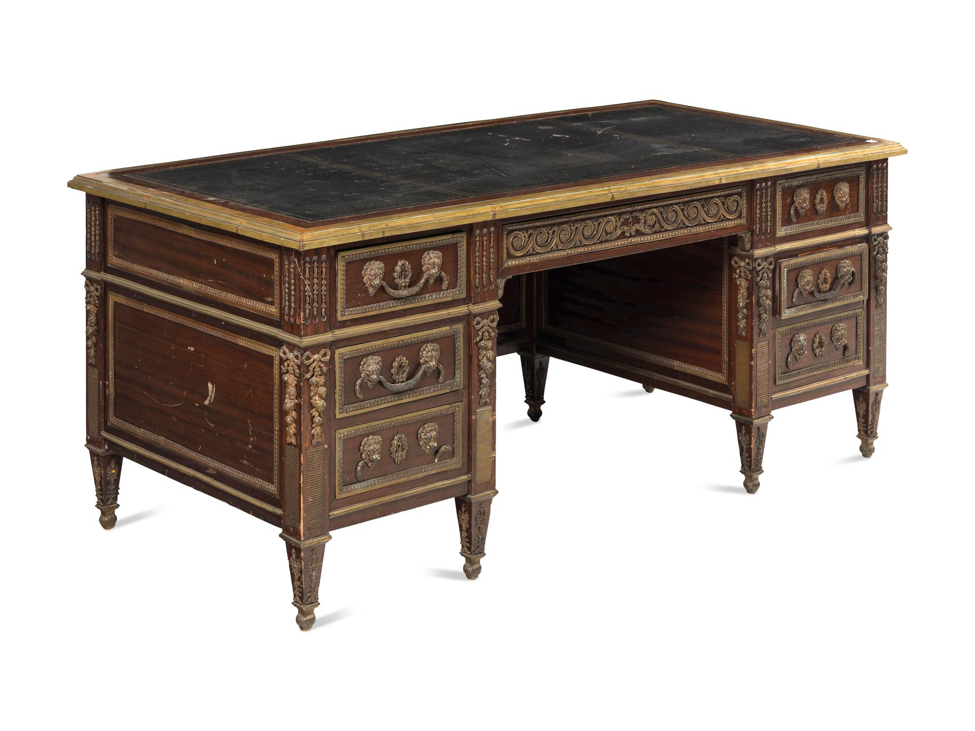 A Louis XVI Style Gilt Metal Mounted Mahogany Pedestal Desk