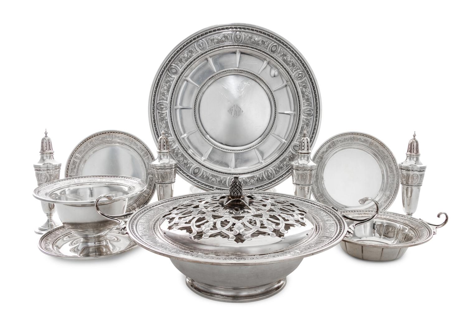 A Set of American Silver Holloware, International Silver Co., Meriden, CT, Wedgwood pattern, comprising four casters, twelve bread plat