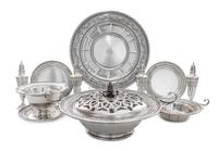 A Set of American Silver Holloware, International Silver Co., Meriden, CT, Wedgwood pattern, comprising four casters, twelve bread plat