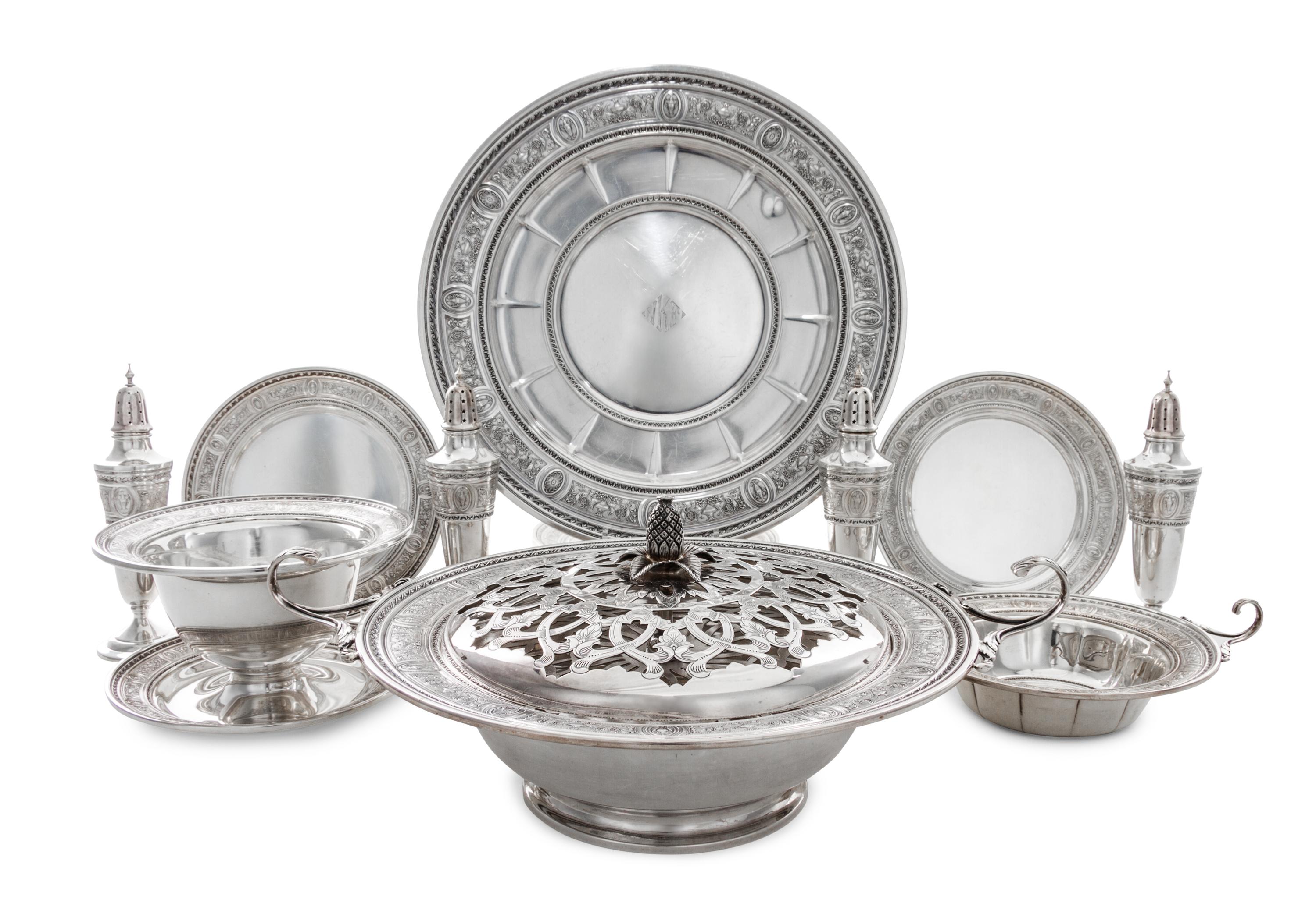 A Set of American Silver Holloware, International Silver Co., Meriden, CT, Wedgwood pattern, comprising four casters, twelve bread plat