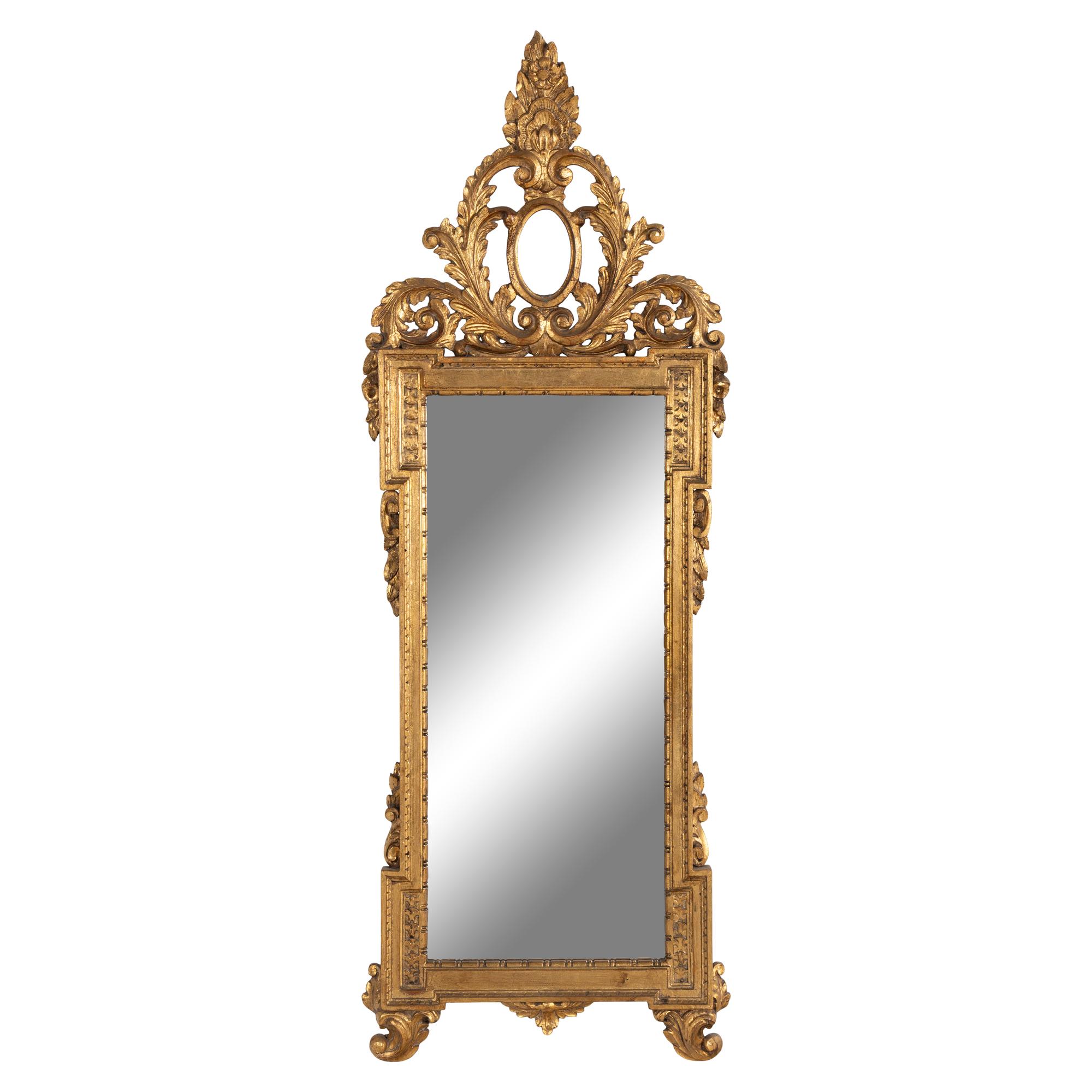 An Italian Baroque Style Giltwood Mirror