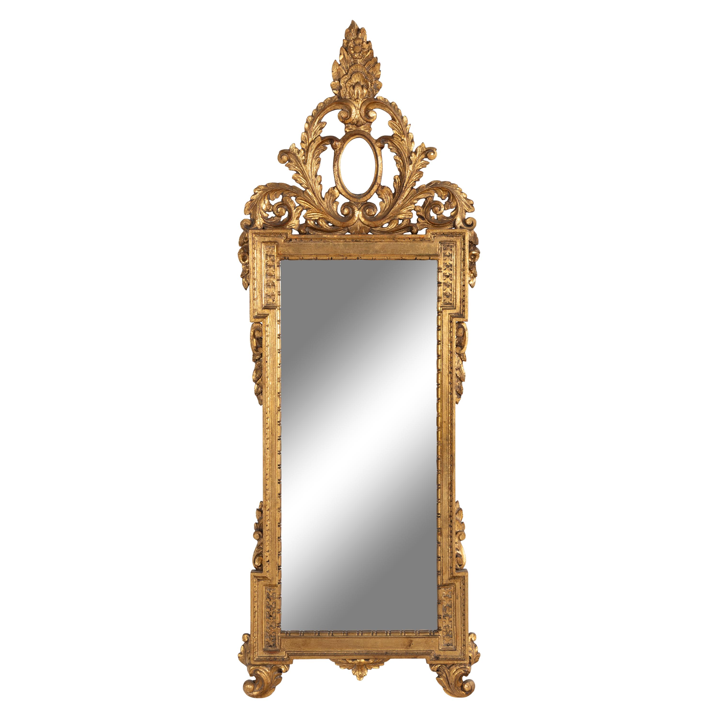 An Italian Baroque Style Giltwood Mirror