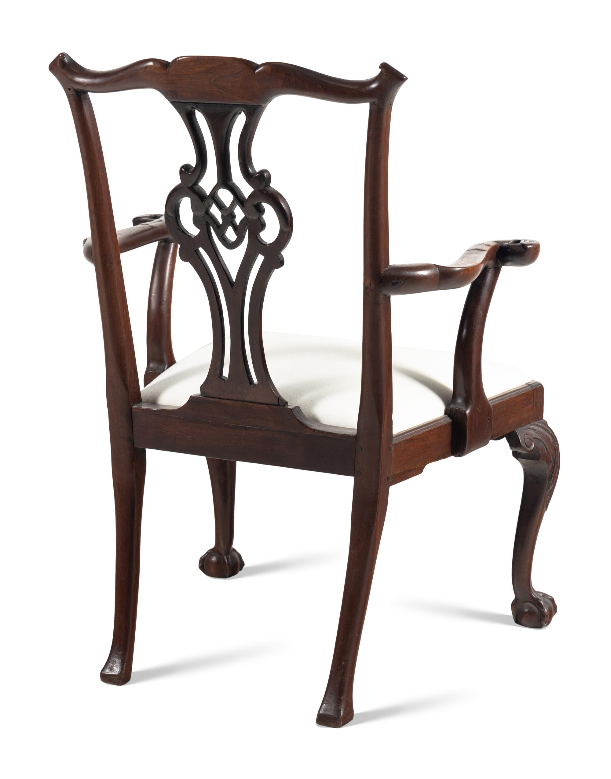 A George III Carved Walnut Open Armchair
