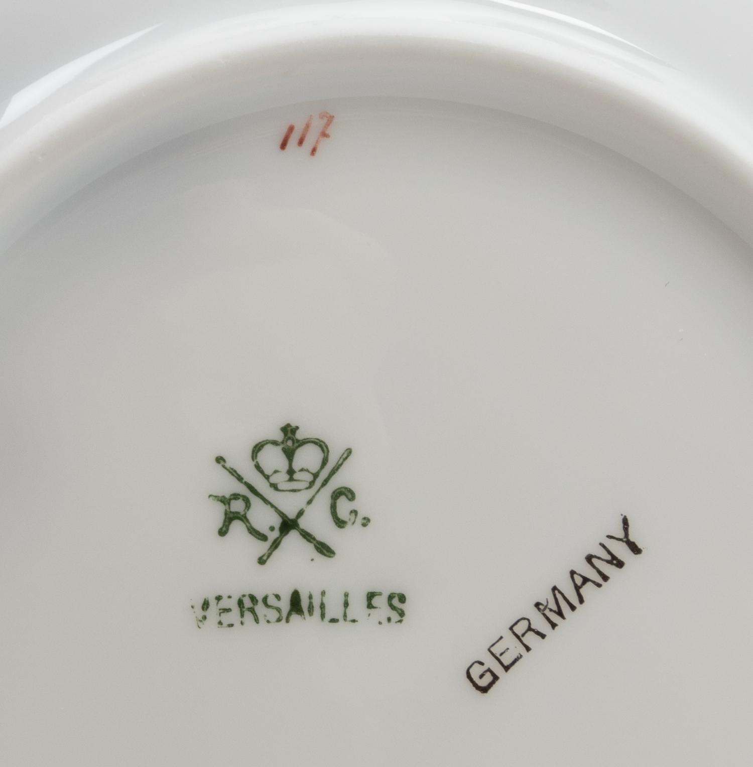 A Set of German Porcelain Teacups and Saucers