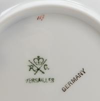 A Set of German Porcelain Teacups and Saucers