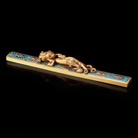A Chinese gilt-bronze and cloisonné "Qilong" scroll weight
