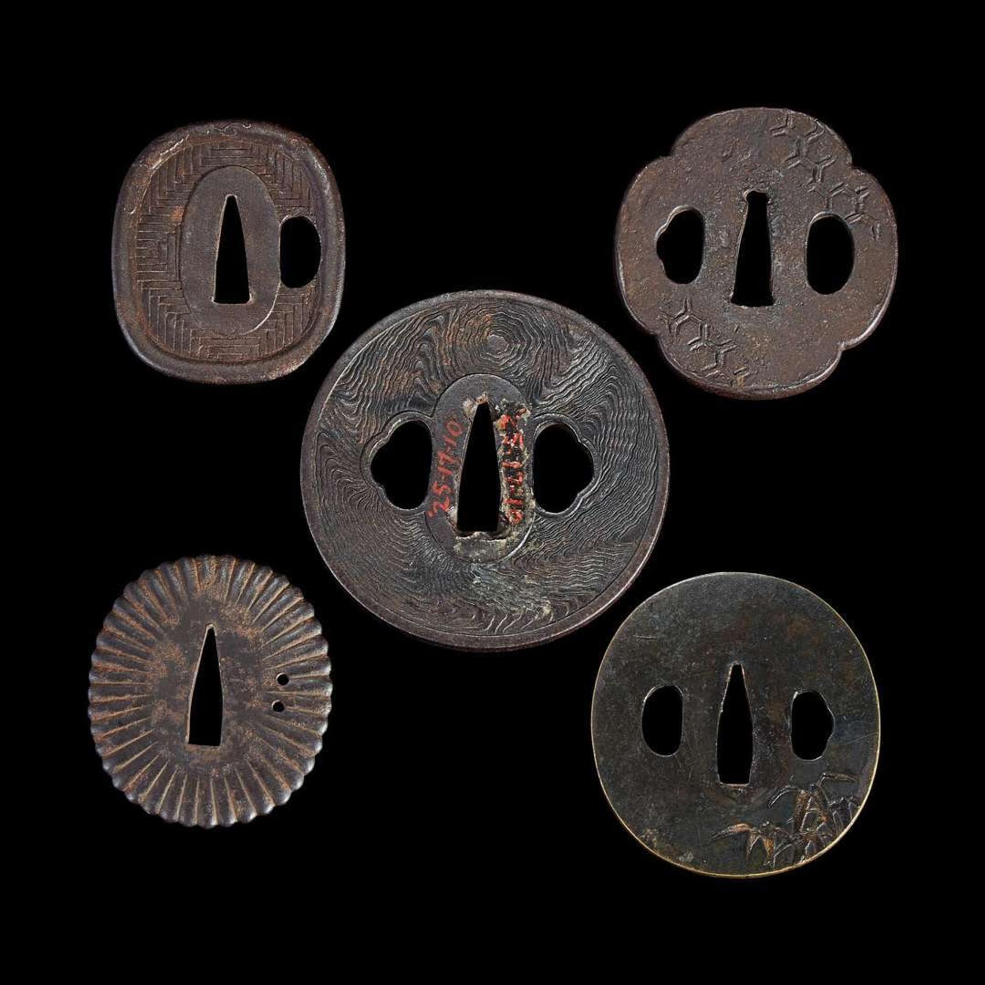 Group of fifteen assorted Japanese tsuba Meiji period and earlier