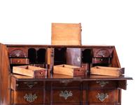 A Chippendale Carved and Figured Mahogany Block-Front Slant-Front Desk