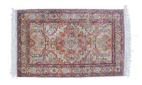 A Persian Silk Rug 6 feet 4 inches x 4 feet.