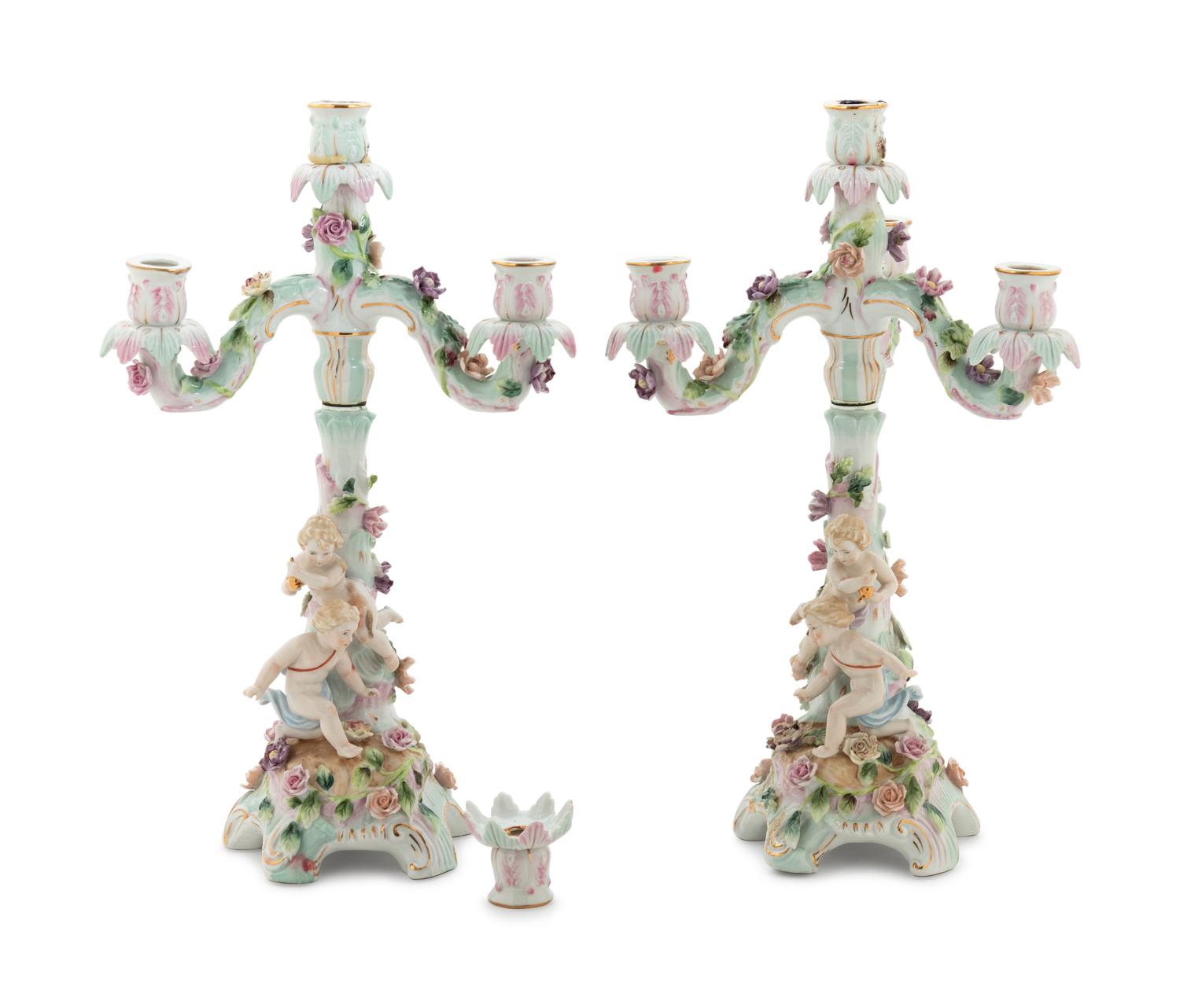 A Pair of Continental Porcelain Figural Candelabra